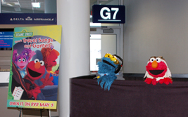 cookie monster and elmo visit Gate G7 at MSP Airport