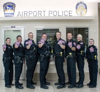 APD officers holding their Pink Patches